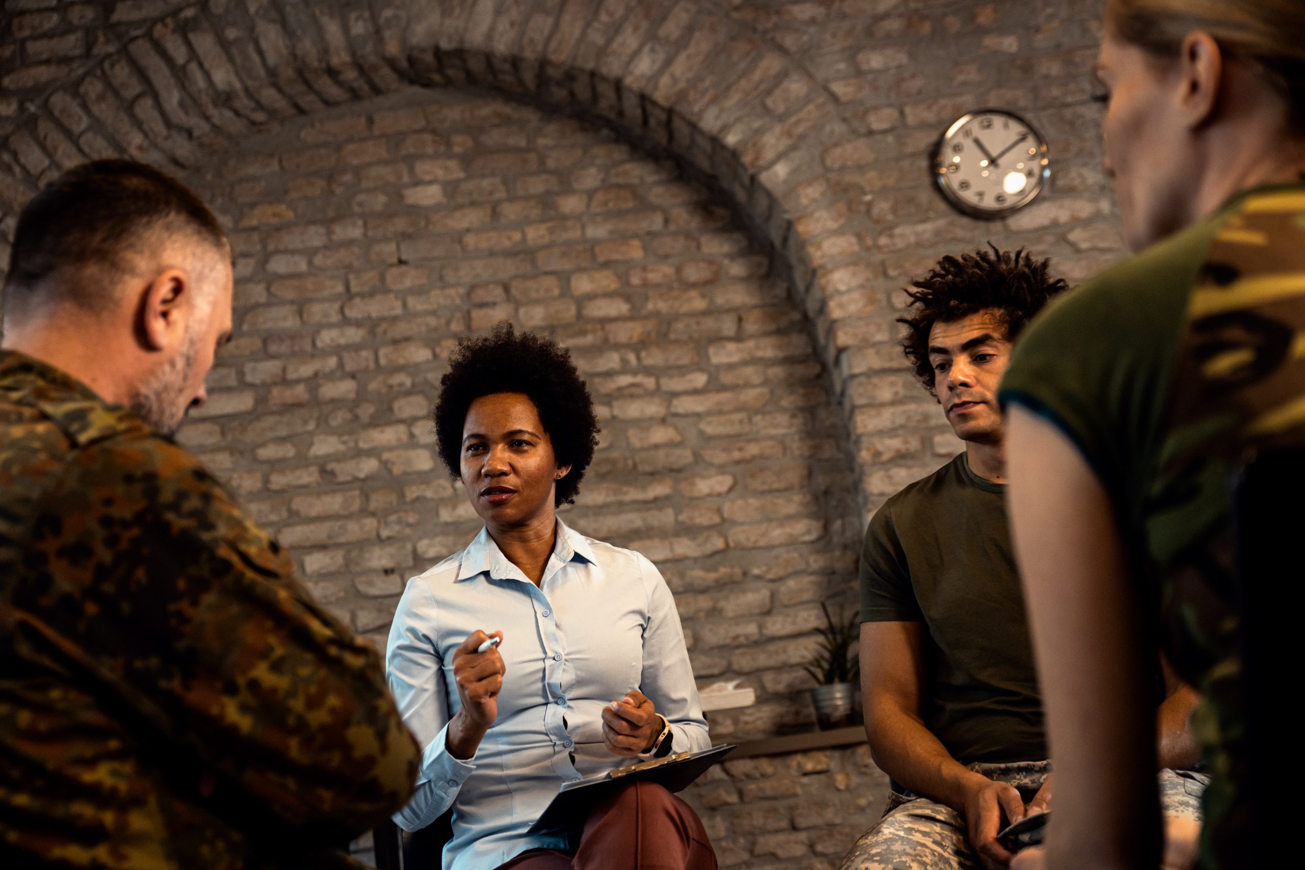 female manager asking employees questions