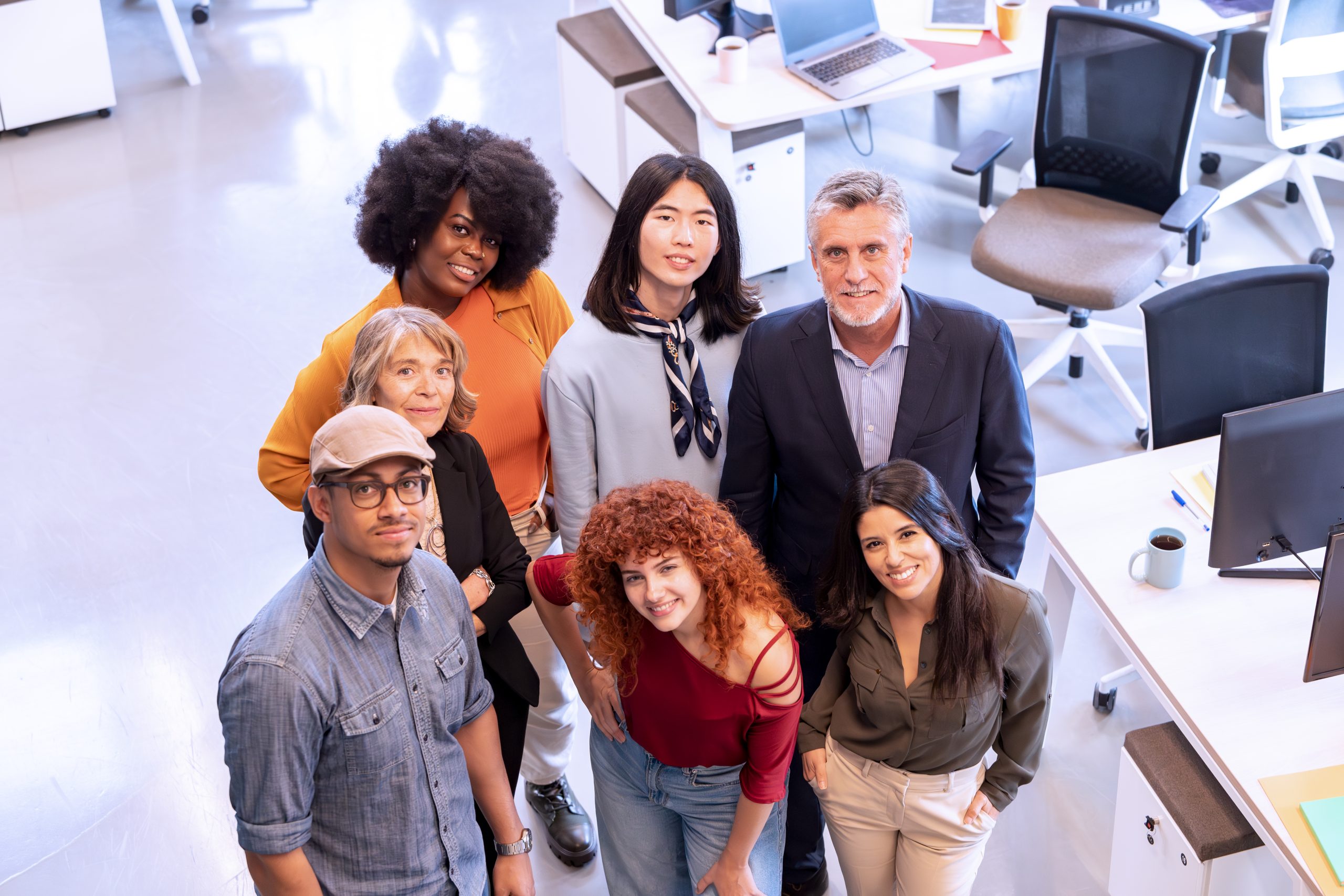 Diverse business team smiling while posing together in the office. Business concept.
